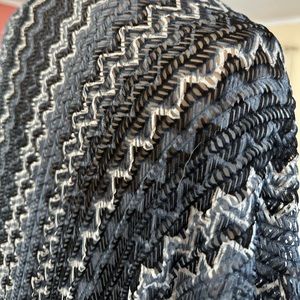 A wrap that can be worn with a dress or slacks.